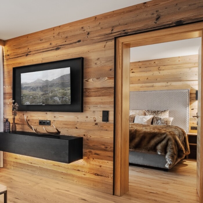 Lodge Widderstein - Lech Valley Lodge in Warth am Arlberg in Österreich - Schlafzimmer und Wohnbereich